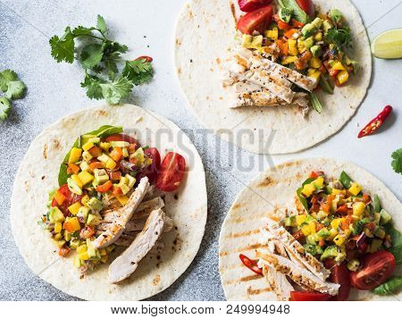 Tortillas With Grilled Chicken Fillet, Salsa Mango Sauce And Tomatoes
