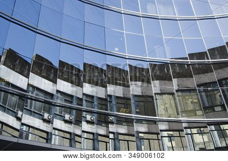 Glazed Building That Generates Strange Reflections Of The Surrounding Buildings, In The Downtown Are