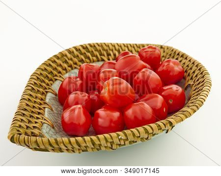 Ripe, Red Cherry Tomatoes Of The Confetto Variety.isolate.white Background