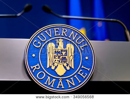 Bucharest, Romania - January 08, 2020: Government logo of the desk from which Romanian Prime Minister Ludovic Orban (not in picture) speaks, at the government headquarters in Bucharest.