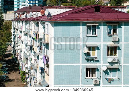 Light Blue Apartment Building 5 Storey With Red Roof. The Concept Of A Residential Quarter. Old Hous