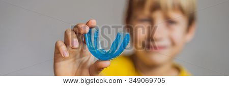 Six-year Old Boy Shows Myofunctional Trainer. Helps Equalize The Growing Teeth And Correct Bite, Dev