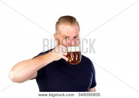 Red haired man with long beard drinking a beer isolated on a white background