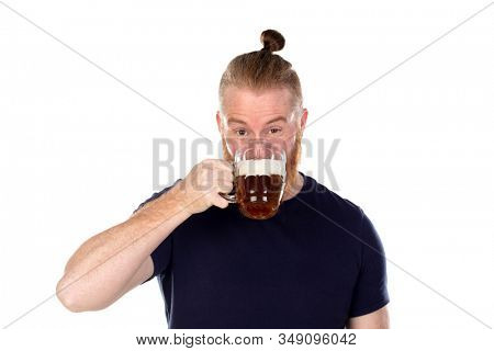 Red haired man with long beard drinking a beer isolated on a white background