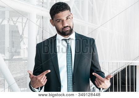 Confident Black Business Man Pointing At Himself. Serious Guy Looking At Camera And Standing With Bu