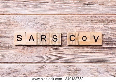 Sars Cov Word Written On Wood Block. Sars Cov Text On Wooden Table For Your Desing, Coronavirus Conc