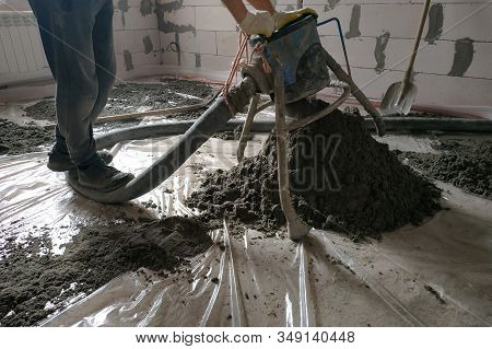 Construction Site - Machine Floor Screed, Pipes For Heating And Floor Heating.