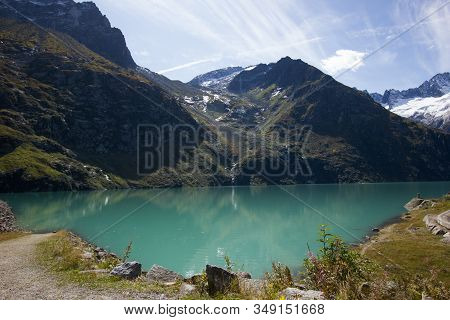 Blue And Green Lake On The Goescheneralp In The Swiss Mountains