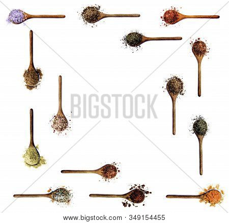 Frame Of Various Spices In Wooden Spoons: Salt With Chili And Petals, Curry, Zira, Coriander, Paprik