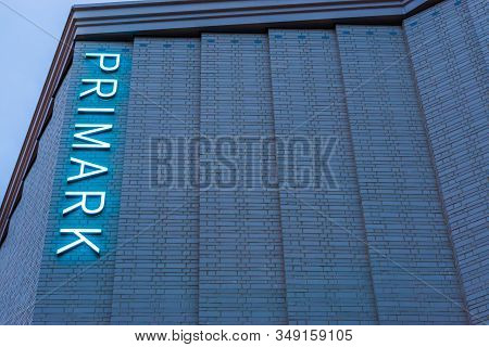 Lighted Primark Neon Sign On The Side Of The Building, Tilburg, The Netherlands,10 December, 2019