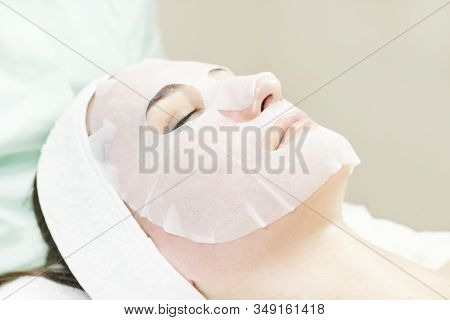 The Woman Undergoes The Procedure Of Medical Micro Needle Therapy With A Modern Medical Instrument D