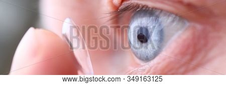 Man Putting On Soft Contact Lens Close-up