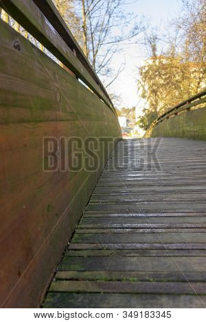 Close Up Of Wooden Bridge In A Small City