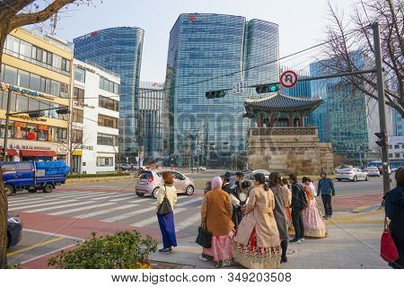 Seoul, Republic of Korea - March 2019: Dongshipjagak, ancient watchtower, Seoul landmark. Modern office buildings in the background.