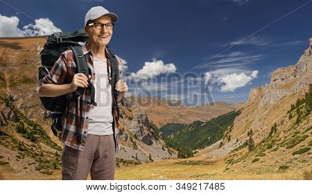 Elderly man hiker with a backpack posing on Shara mountain, Macedonia