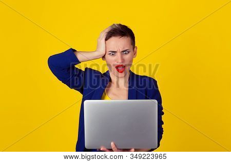 I Got Hacked.  Shocked Business Woman With Laptop Computer Looking At Screen Isolated Yellow Backgro