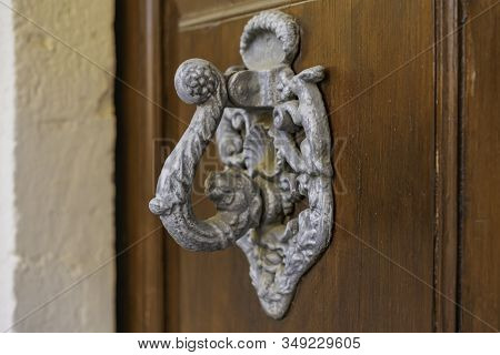 Handle On Wooden Door Of Old Building In The Village Arbos Del Panades . The Town Is A Located In Th