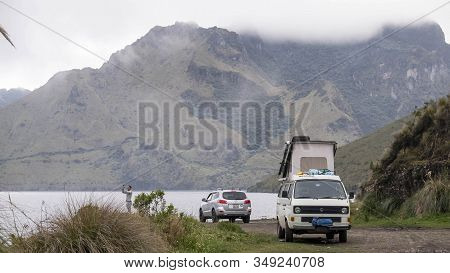 Mojanda Lagoon, Ecuador - February, 21st, 2019: Two Vehicles Parked At The Shore