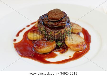 Beef steak with foie gras and truffles, close-up