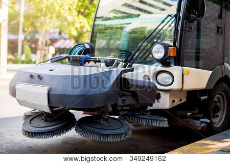 The Special Car Cleans City Road. Detail Of A Street Sweeper Machine.