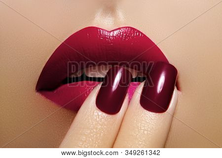 Beautiful Close-up Lips With Fashion Red Makeup. Beauty Lip Visage. Passionate Kiss. Bright Cherry L