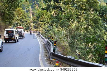Darjeeling, West Bengal, India- December 25, 2019: Cars On A Mountain Road With A Very Acute Inner A
