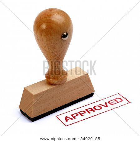 Rubber stamper with the word APPROVED printed in red