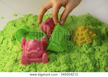 Kinetic Sand. A Child Plays With Kinetic Sand. Fine Motor Skills, Creativity, Games