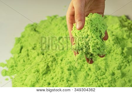 Kinetic Sand. A Child Plays With Kinetic Sand. Fine Motor Skills, Creativity, Games