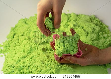 Kinetic Sand. A Child Plays With Kinetic Sand. Fine Motor Skills, Creativity, Games
