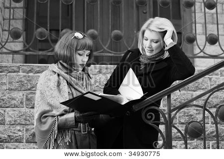 Young businesswomen with a floder