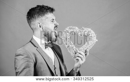 Hipster Hold Heart Symbol Love. Bring Love To Family Holiday. Romantic Surprise. Man In Love Strict 