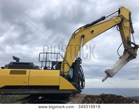Hydrohammer During Road Construction Works On The Rocky Soils.