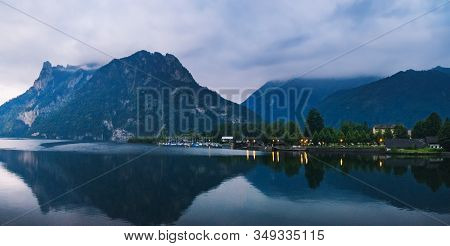Night View Of Traunsee Lake In Upper Austria In Summertime. Dramatic Cloudscape Evening Scenery With