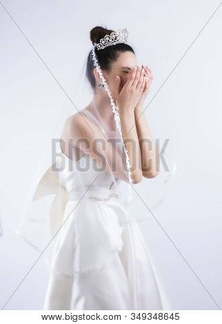 Young Bride Crying Isolated On Gray Background