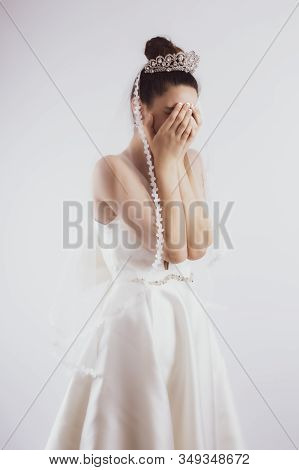 Young Bride Crying Isolated On Gray Background