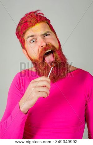 Lollipop. Sweet Food, Sugar And Enjoying Concept. Dessert. Licking Candy. Bearded Man With Lollipop.