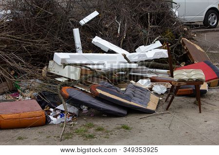 A Pile Of Household Furnishings, Damaged By Hurricane, Placed Curbside, Awaiting Trash Removal.