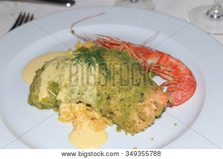 Scrimp And Risotto With Pesto Sauce On A Plate