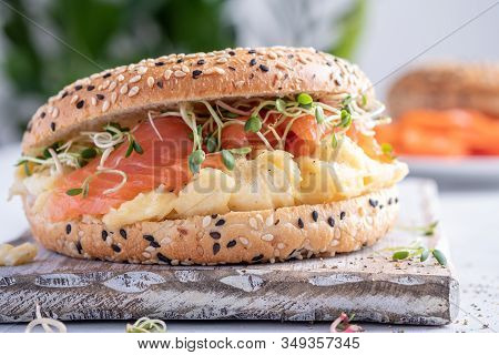 Breakfast Sandwich On Bagel With Salmon And Scrumbled Egg