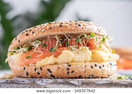 Breakfast Sandwich On Bagel With Salmon And Scrumbled Egg