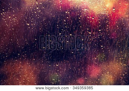 Street Lights Through The Rainy Window At Night. Backgrounds.