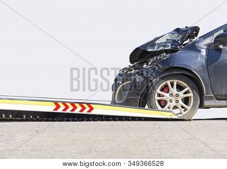 Accident Car Slide On  Truck For Move. Black Car Have Damage By Accident On Road Take With Slide Tru