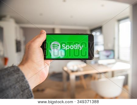 Amsterdam, The Netherlands, 02/06/2020, Man Holding His Phone, Spotify Start Screen On Smartphone, M