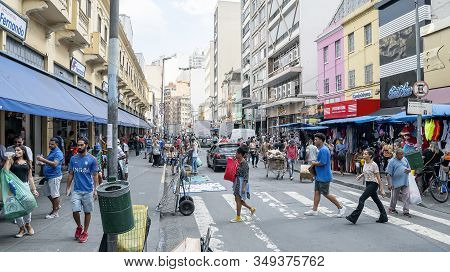 Sao Paulo Sp, Brazil - November 22, 2019: Popular Commerce At March 25 Street. People On The Streets