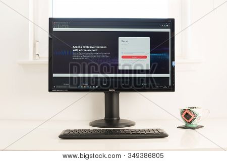 Computer Desktop With Shutterstock Website On Screen. Keyboard And Coffee Mug On White Table. Retro 
