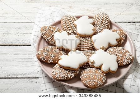 Easter Cookies On A Plate On A Wooden Background. Easter Bunnies. Easter Eggs