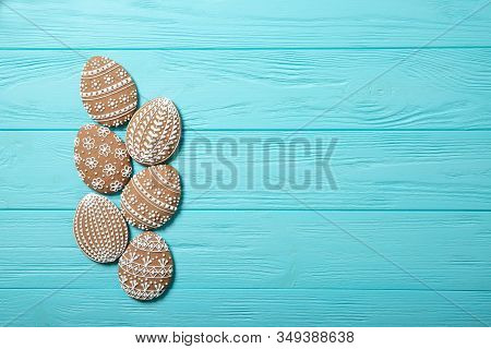 Easter Cookies In A Plate On A Blue Background. Easter Eggs. Easter Bunnies. Place For Text. Top Vie