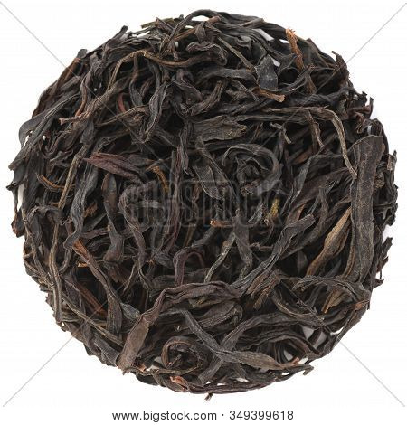 Big Leaves Chinese Tea. Mi Lan Xiang Dan Cong Oolong Tea In Round Shape Isolated On White Background