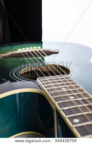 Classic Acoustic Guitar In Azure Color, On A White Background, Close-up.